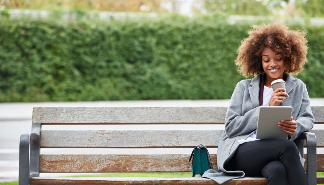 Woman resting sitting on the bench near New Medford in Medford, Oregon