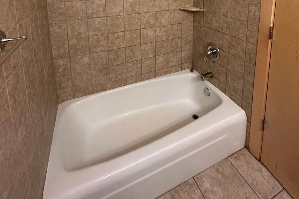 Upgraded bathroom with tiled shower at 311 Kenwood Parkway in Minneapolis, Minnesota