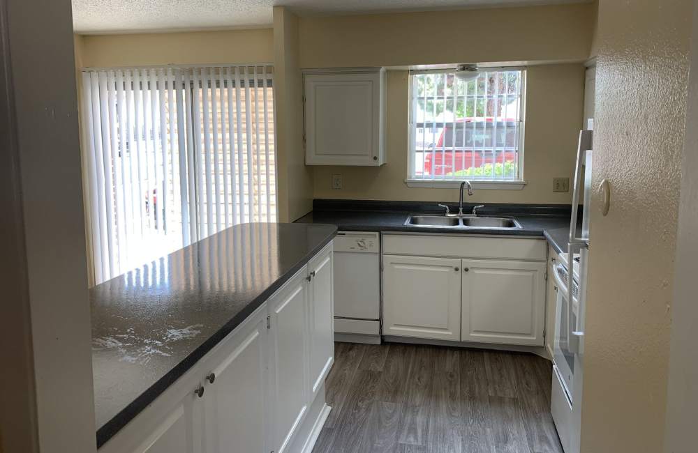 Apartment kitchen with modern appliances at Sagewood in El Paso, Texas