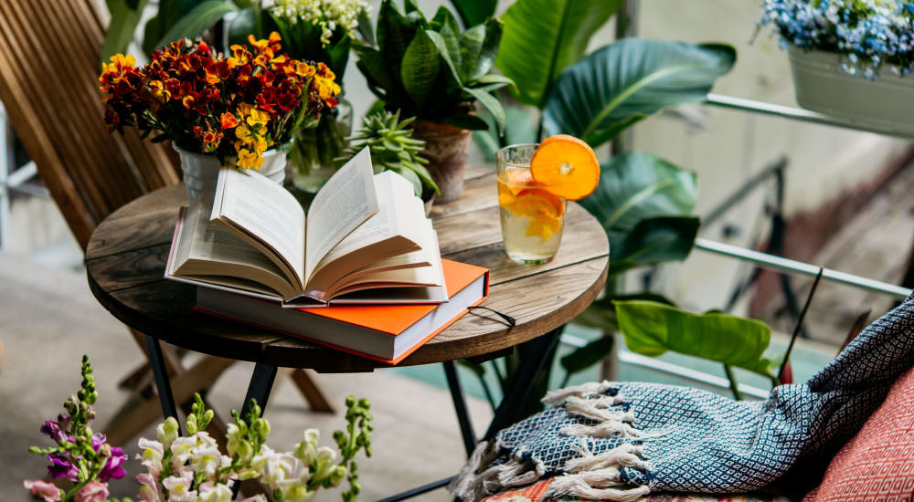 Reading area on a patio of Mission Gardens in Santa Cruz, California