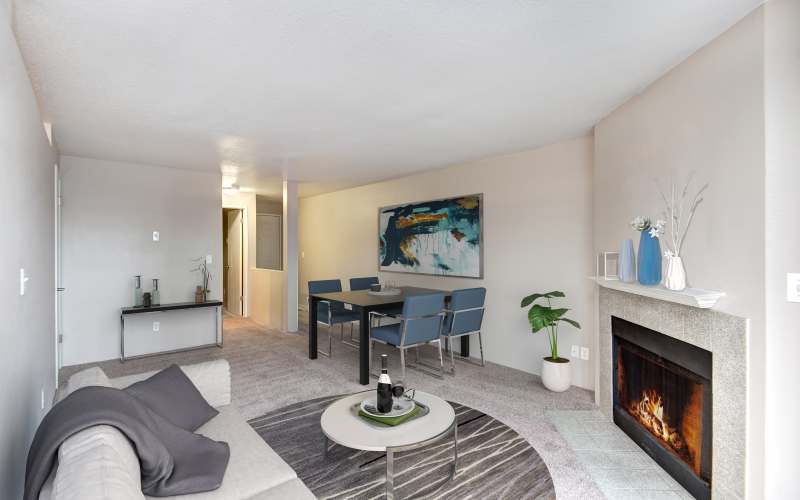 Bright Living Room with Fireplace at Wellington Apartments in Silverdale, Washington