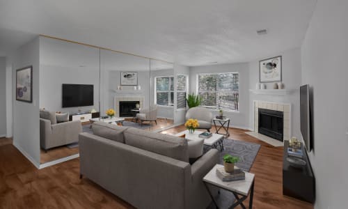 Hardwood flooring and furniture in a model apartment living room at Five7Five in Austell, Georgia