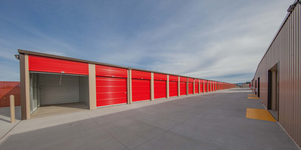 Outdoor storage units with a wide driveway at StorQuest Express Self Service Storage in Phoenix, Arizona