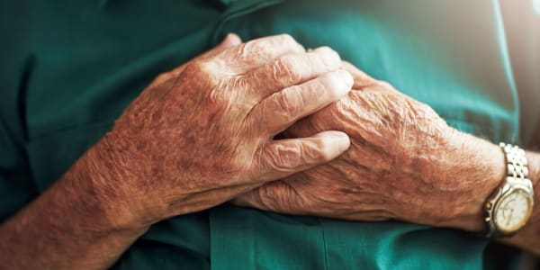 Resident holding their heart peacefully at Holton Manor in Elkhorn, Wisconsin