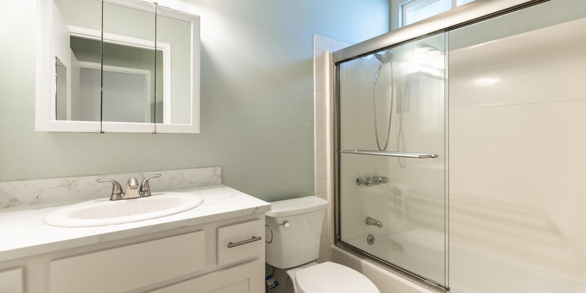 Bathroom with large vanity and enclosed shower at  South Knoll in Mill Valley, California