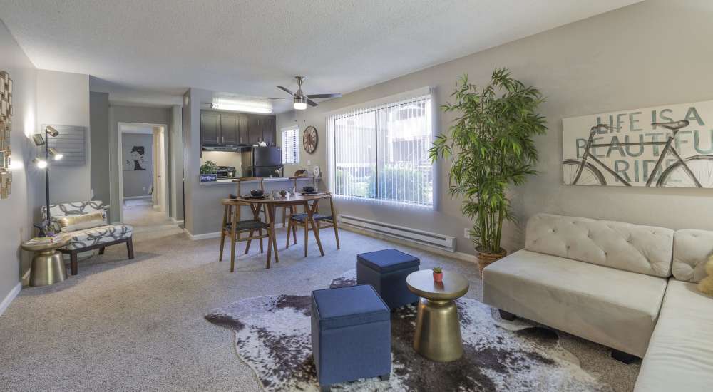 Modern well-lit living and kitchen space at Woodchase Apartments in San Leandro, California