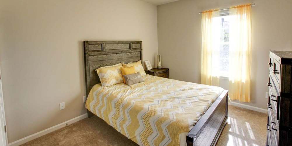 Bright bedroom with windows at Villas at Fort Mill in Fort Mill, South Carolina