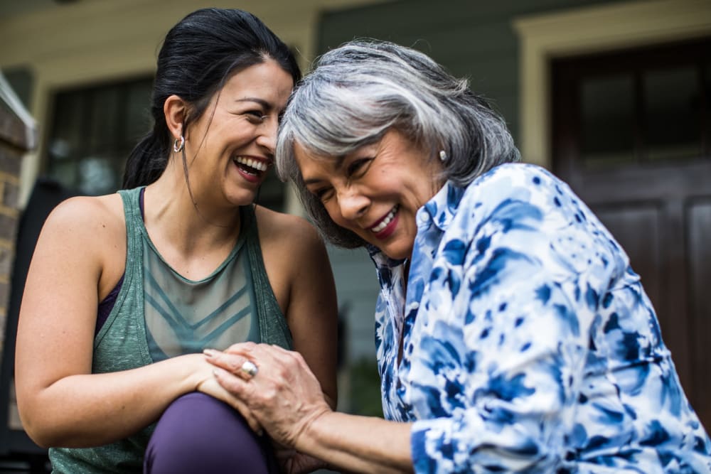 Two women laughing at Ridgeline Management Company in Rockwall, Texas