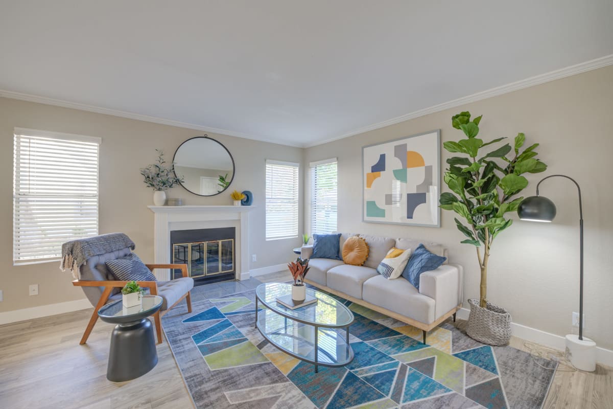An apartment living room with a fireplace at Ardella on Chagall in Moreno Valley, California