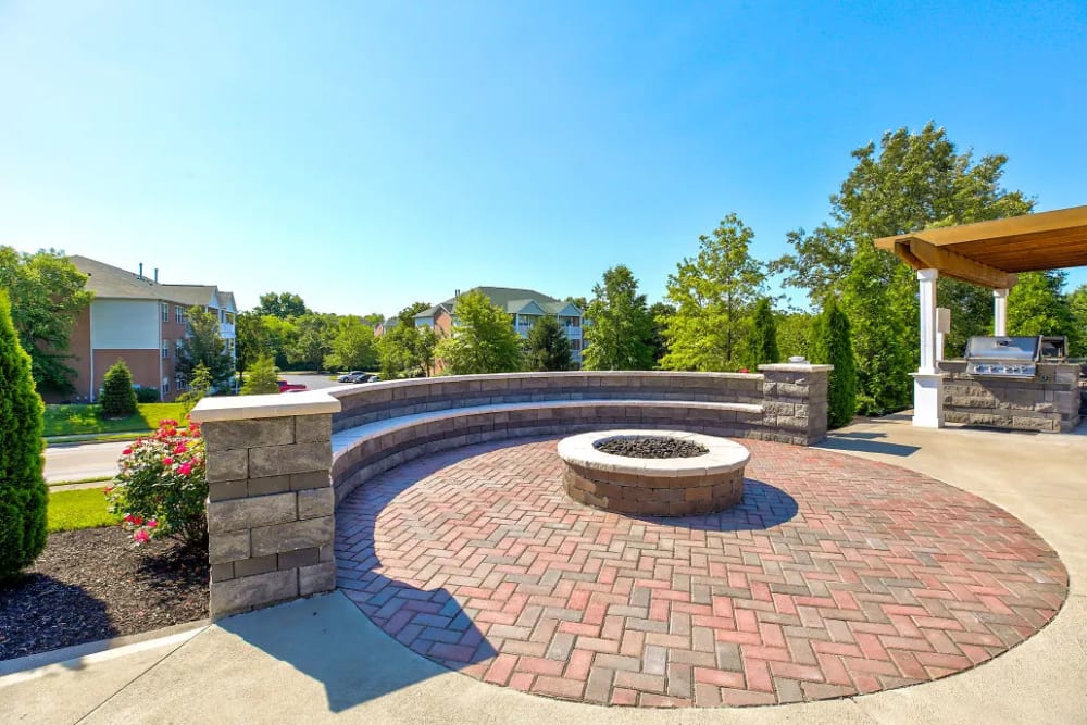 The gas fire pit with ample seating at Charleston Pines Apartment Homes in Florence, Kentucky