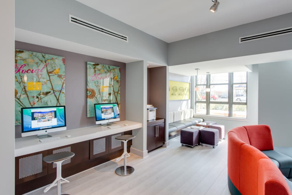 Modern clubhouse lounge with computer stations at Solaire 10914 Georgia in Silver Spring, Maryland