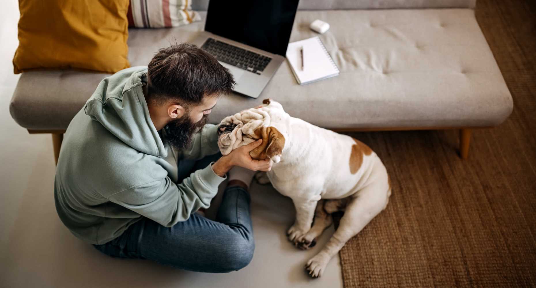 Resident playing with his puppy at Flatiron District at Austin Ranch in The Colony, Texas