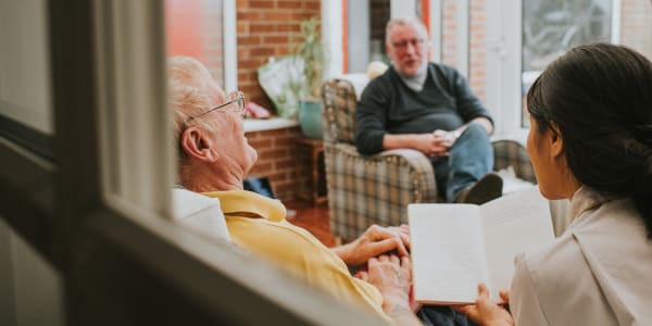 Bible study session led by a caretaker at Fair Oaks Health Care Center in Crystal Lake, Illinois