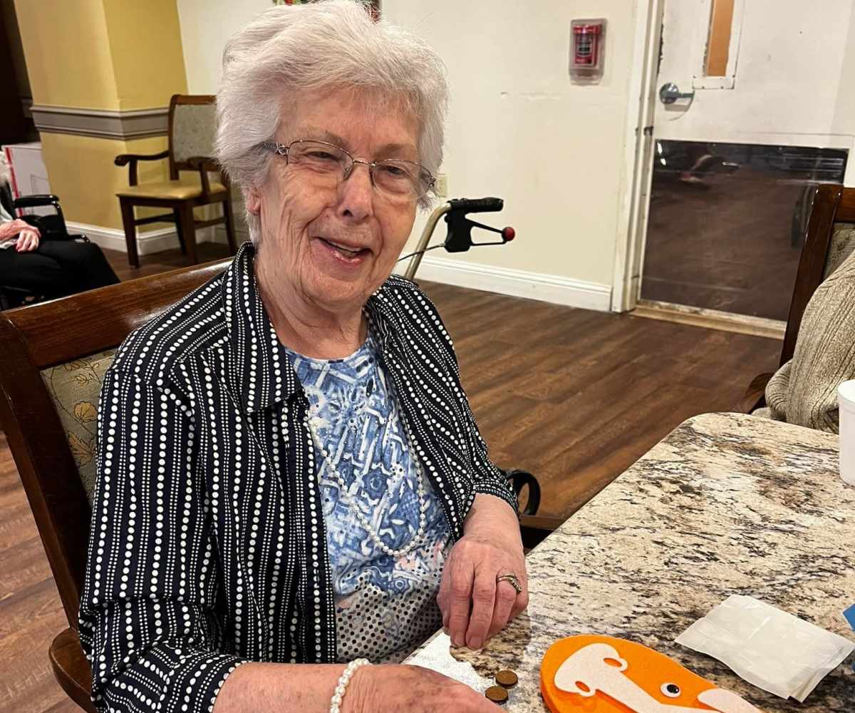 Resident with caretaker at Isle at Raider Ranch in Lubbock, Texas