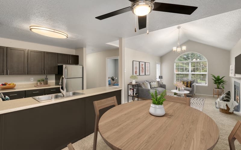 Spacious floor plan with the kitchen overlooking the living room at Carriage Park Apartments in Vancouver, Washington