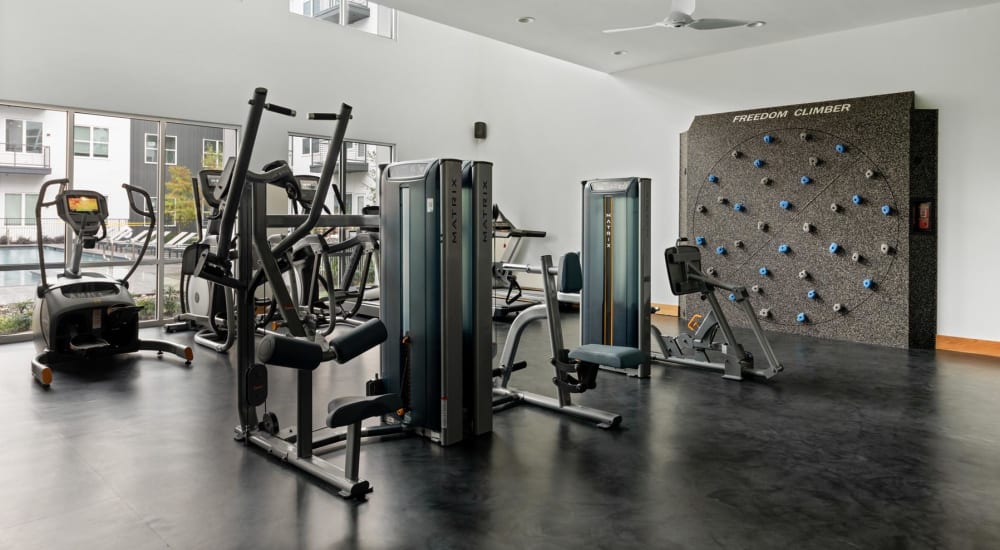 Well-equipped fitness center with a bouldering wall at 4600 Ross in Dallas, Texas