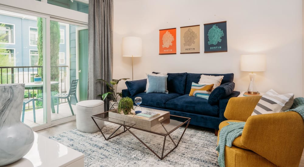 Ceiling fan and modern furnishings in a model home's living area at Lakeshore Pearl in Austin, Texas