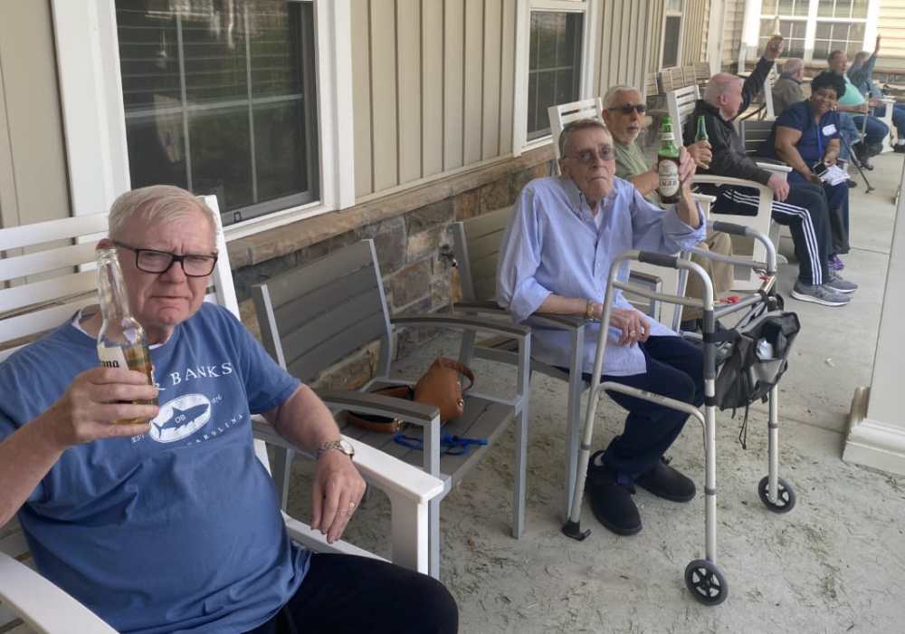 Residents enjoying a drink and the outdoor area at Merrill Gardens at West Chester in West Chester, Pennsylvania