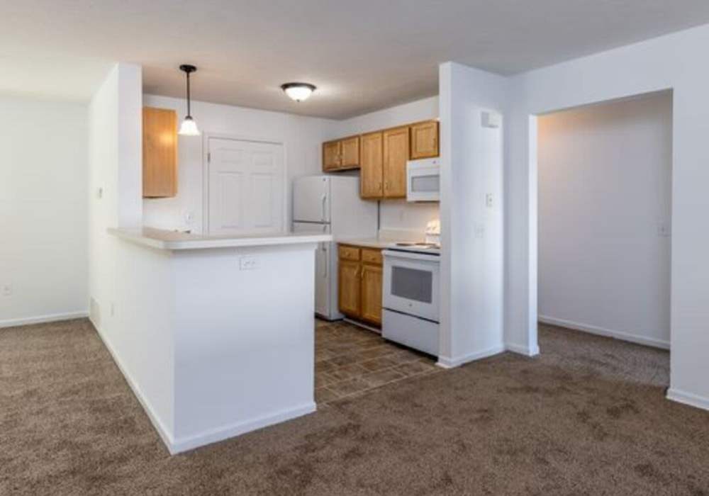 Apartment kitchen with appliances at Heritage Park Apartments & Townhomes in Webster, New York