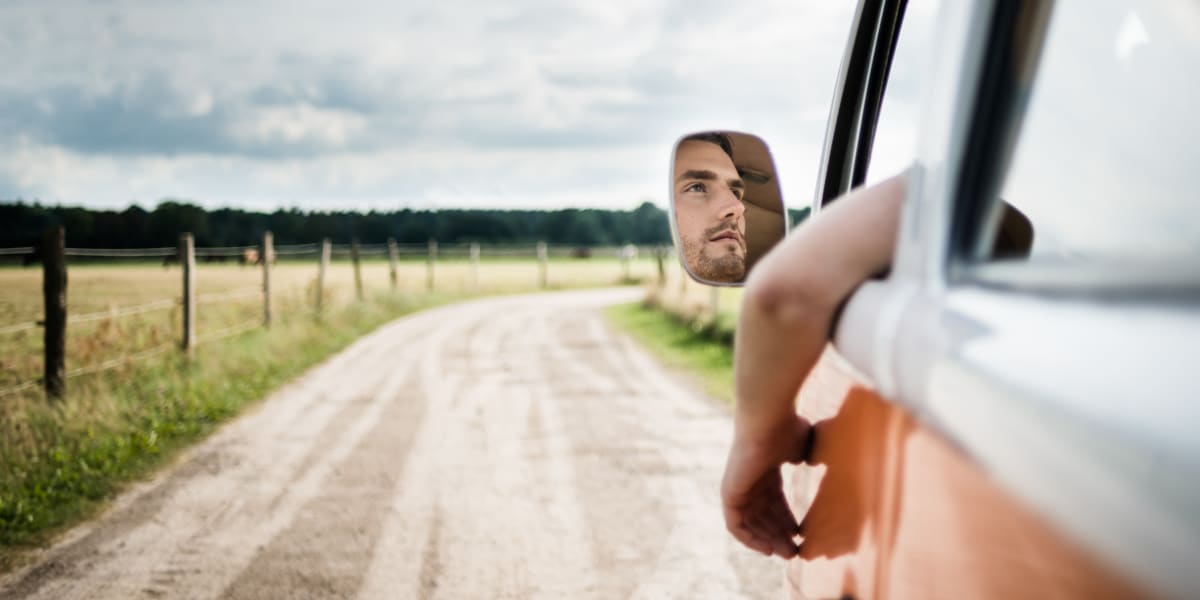 StoreLine RV storage customer driving a vintage van down a country road