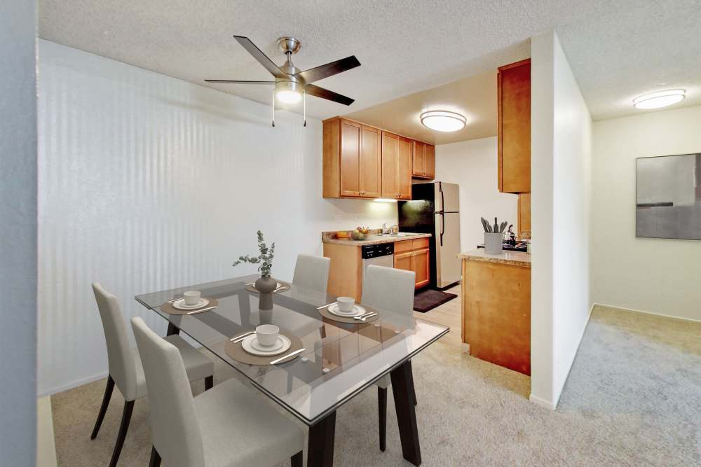 Kitchen with island and dining area at Lakeside Village in San Leandro, California