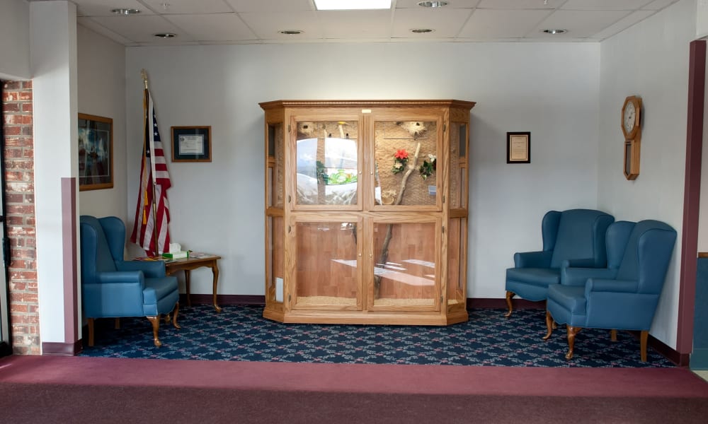 Waiting area with cozy blue chairs at Ingleside Communities in Mount Horeb, Wisconsin