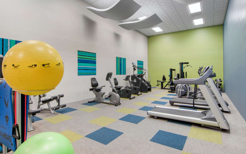 The fully equipped fitness center with cardio machines at Autumn Chase Apartments in Vancouver, Washington