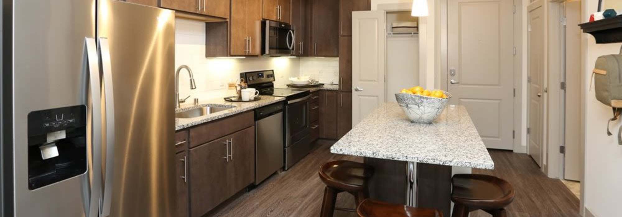 Kitchen with wooden cabinets at The Marling in Madison, Wisconsin