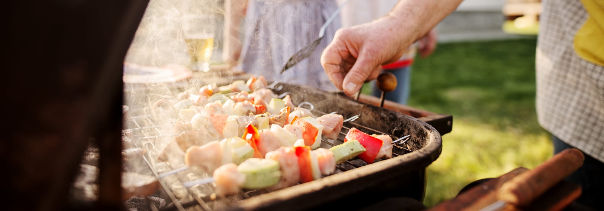 A resident cooking at a barbeque during an event at Yorktown (NWS) in Newport News, Virginia