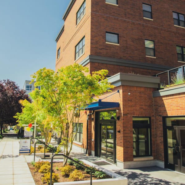 Sidewalk in front of the main entrance to Quail Park Memory Care Residences of West Seattle in Seattle, Washington