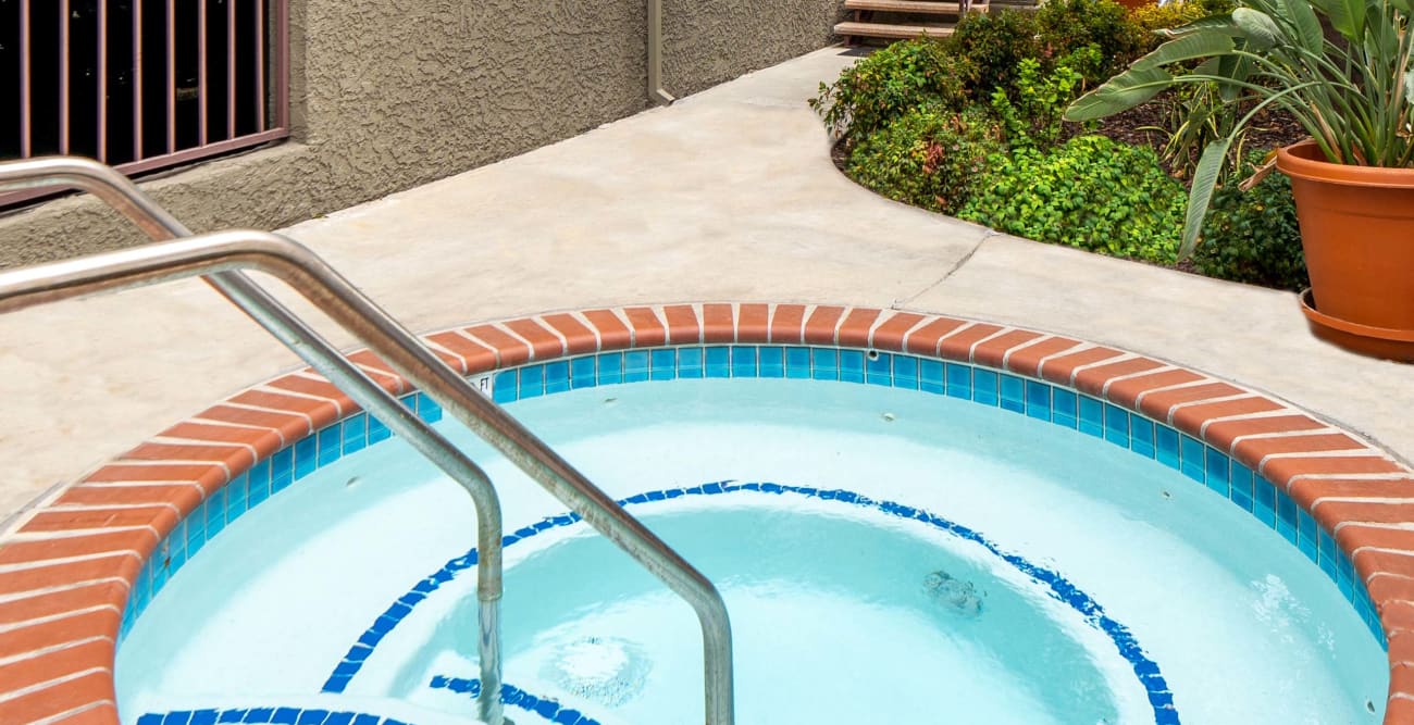 The spa at the Hallmark Apartment in Sherman Oaks, California, surrounded by beautifully manicured landscaping