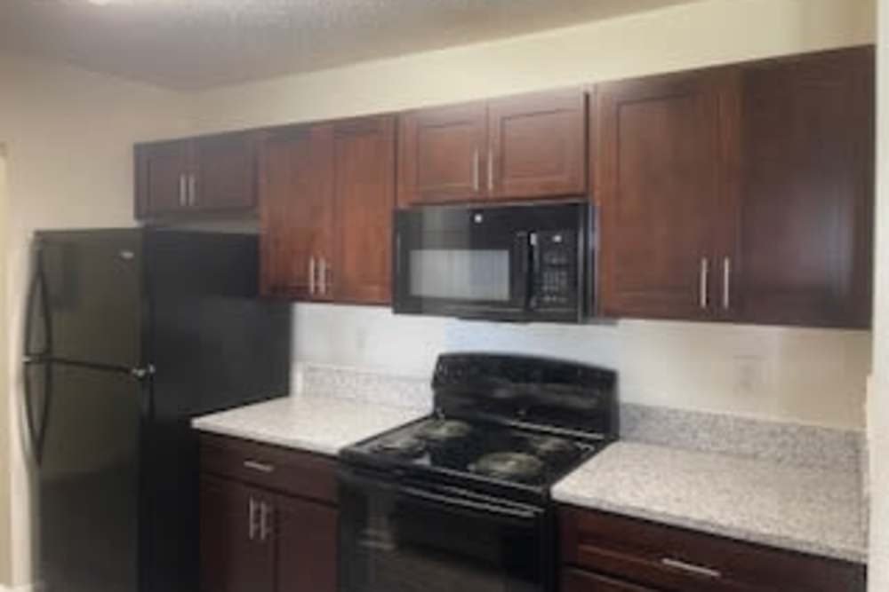 Fully equipped kitchen with appliances at Brittany Place Lagrange in LaGrange, Georgia