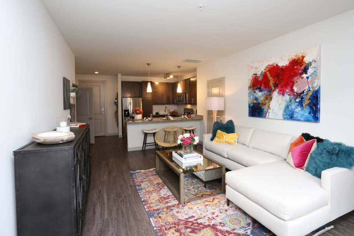 Living room with wood-style flooring at The Marling in Madison, Wisconsin