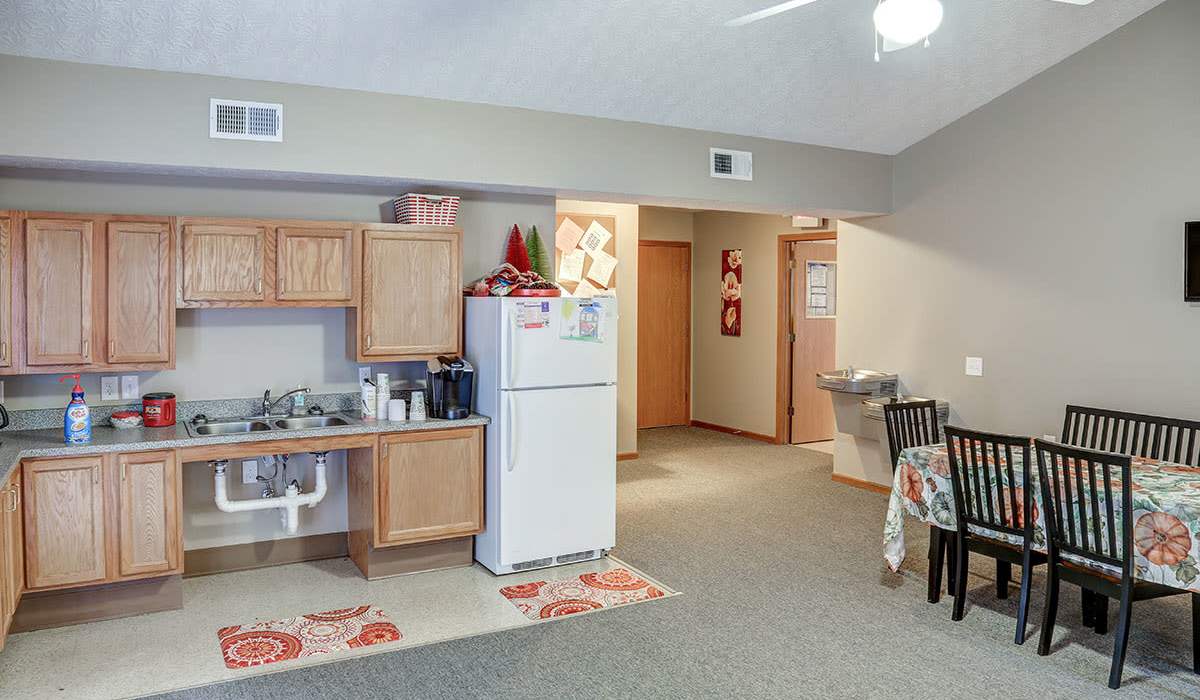Community room with carpet flooring at Preston's Crossing in Prestonsburg, Kentucky