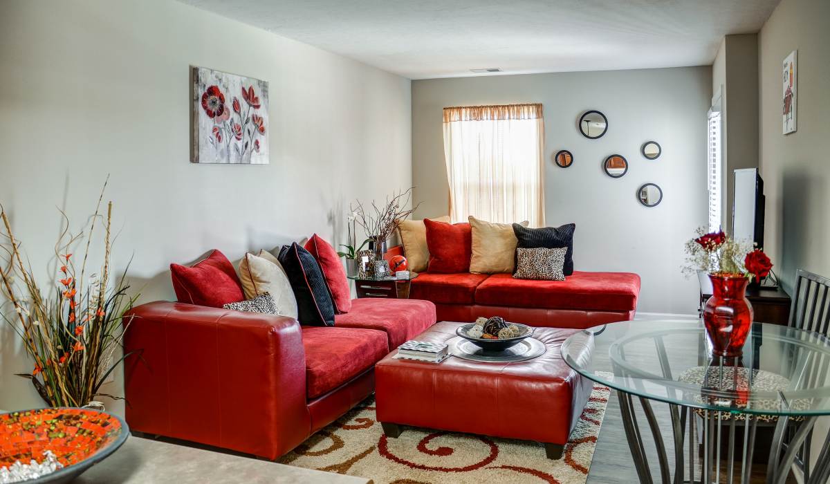 Bright living room with a comfortable couch and a coffee table at The Banks At Berkley in Norfolk, Virginia