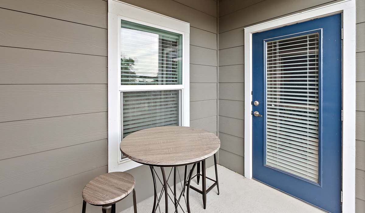 Private balcony with seating at Canyon House in New Braunfels, Texas