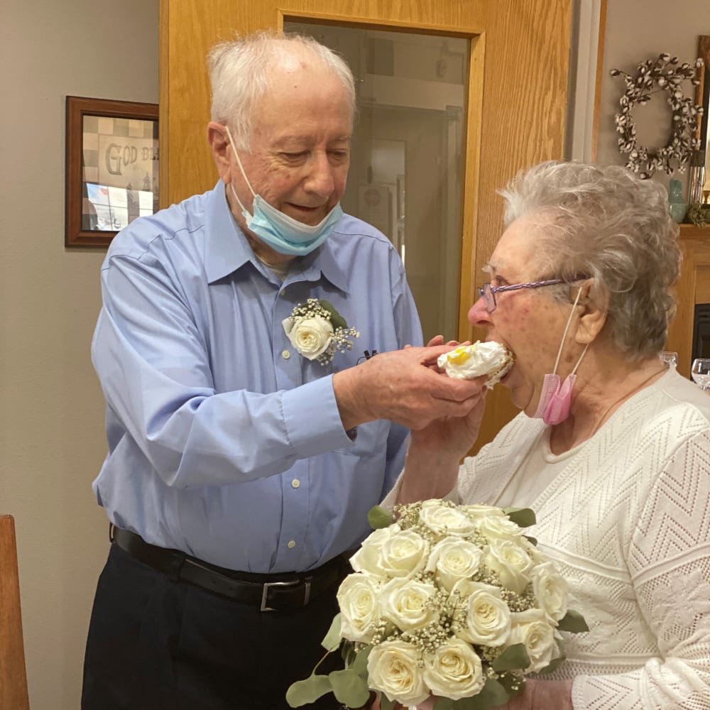 Residents sharing cake at birthday at Glenwood Place in Marshalltown, Iowa.