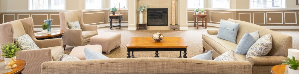 Resident lounge with fireplace at The Heritage Memory Care in The Woodlands, Texas