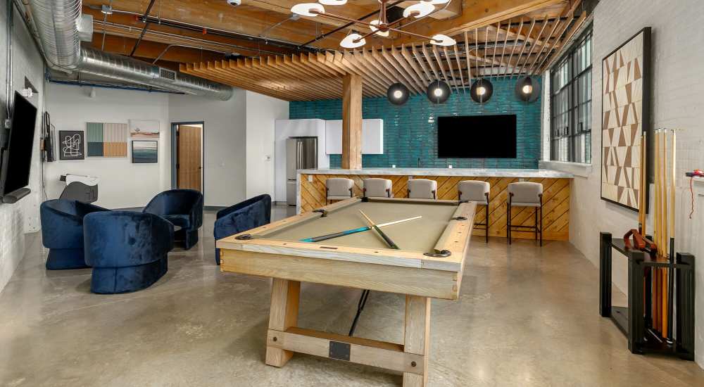 Clubhouse with kitchen and pool table at Box Board Lofts in Grand Rapids, Michigan