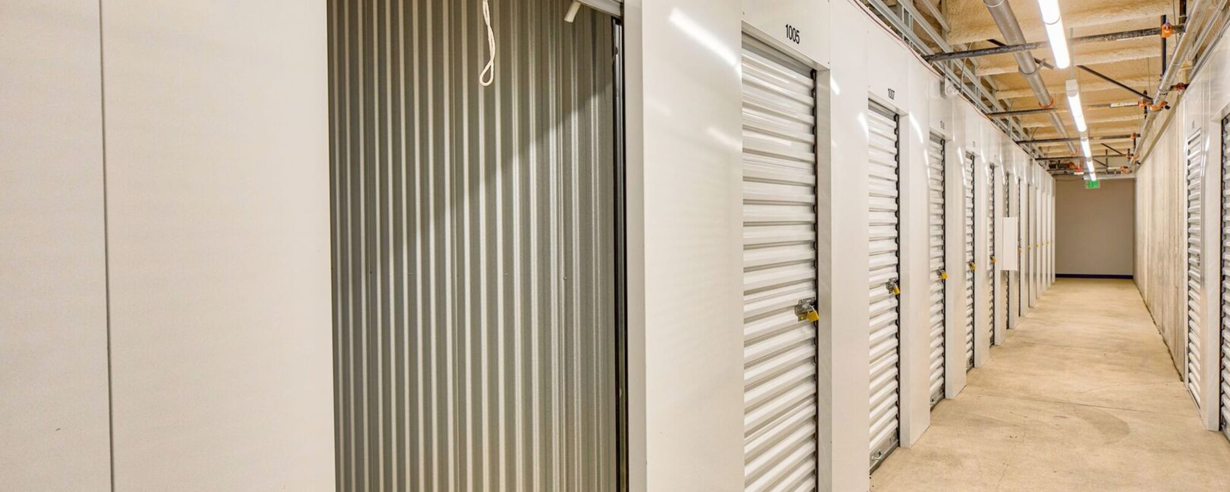 Bright lighting in the hallways at 12th Street Storage in Tacoma, Washington