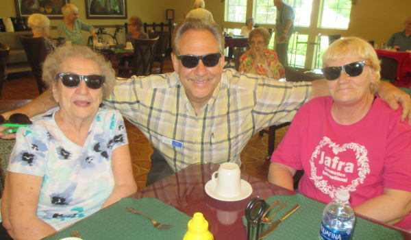 Happy seniors having lunch at Eastern Star Masonic Retirement Campus in Denver, CO