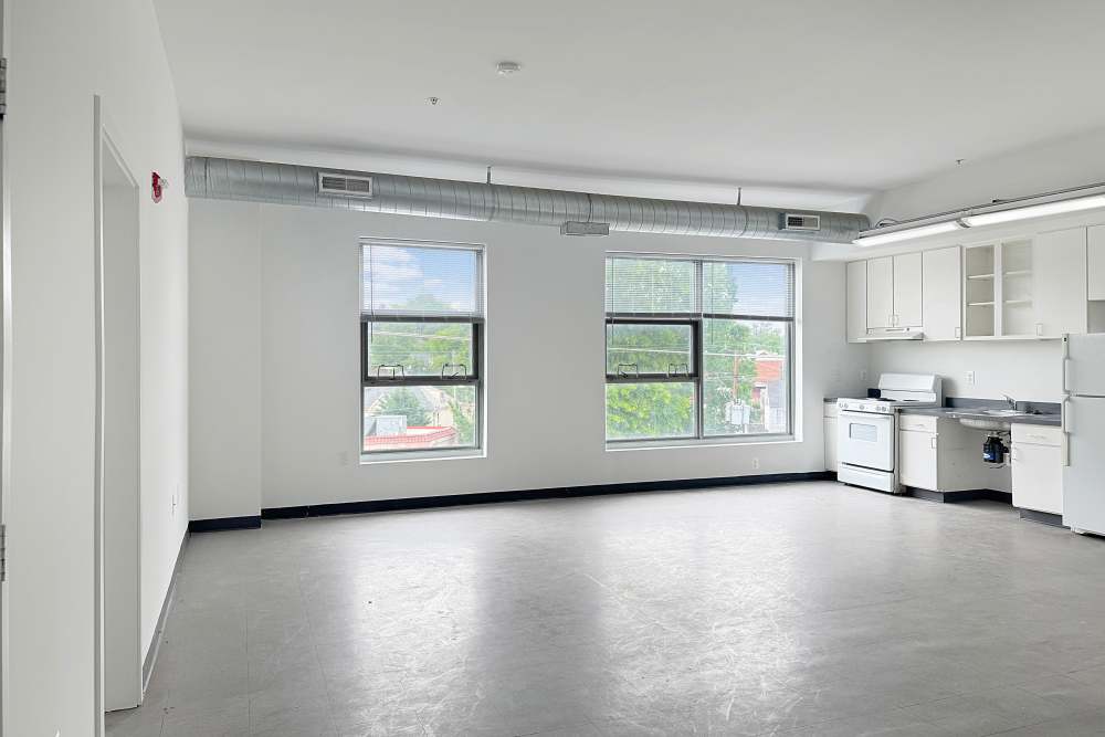 Open kitchen with large windows at Artspace Lofts Mount Rainier in Mount Rainier,Maryland