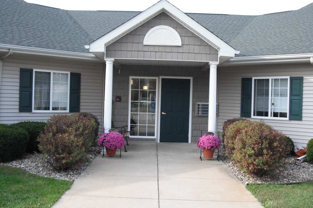 Entrance view of building at Woodbrook Apartments in Three Rivers, Michigan