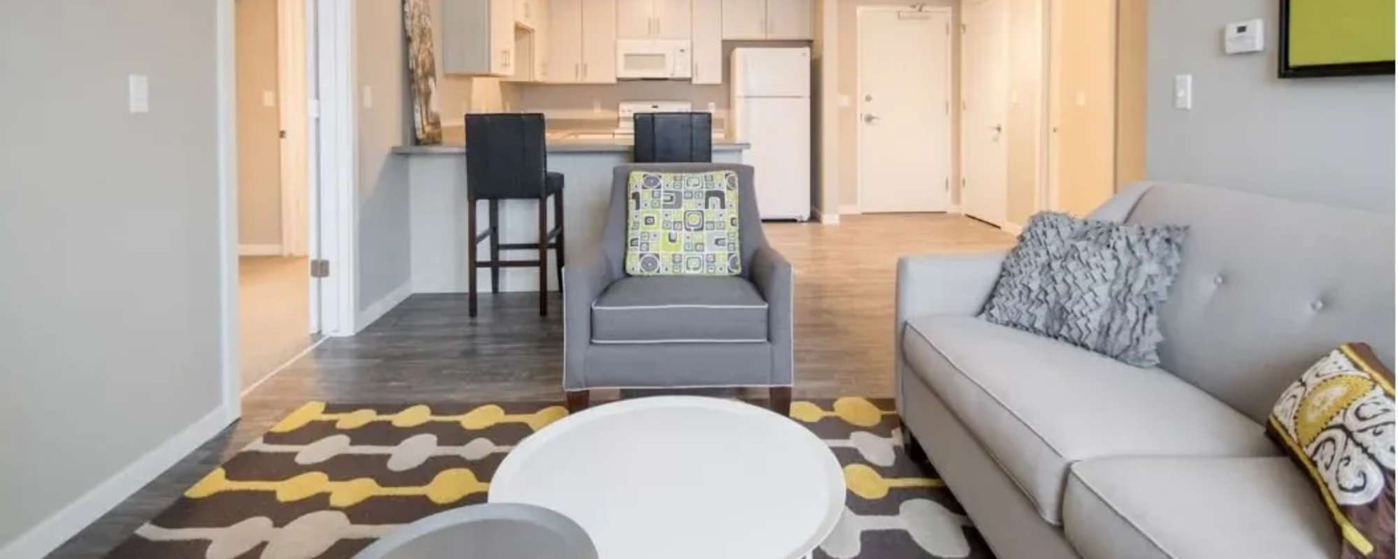 Modern living room with a view to kitchen at 30 Metro in Omaha, Nebraska