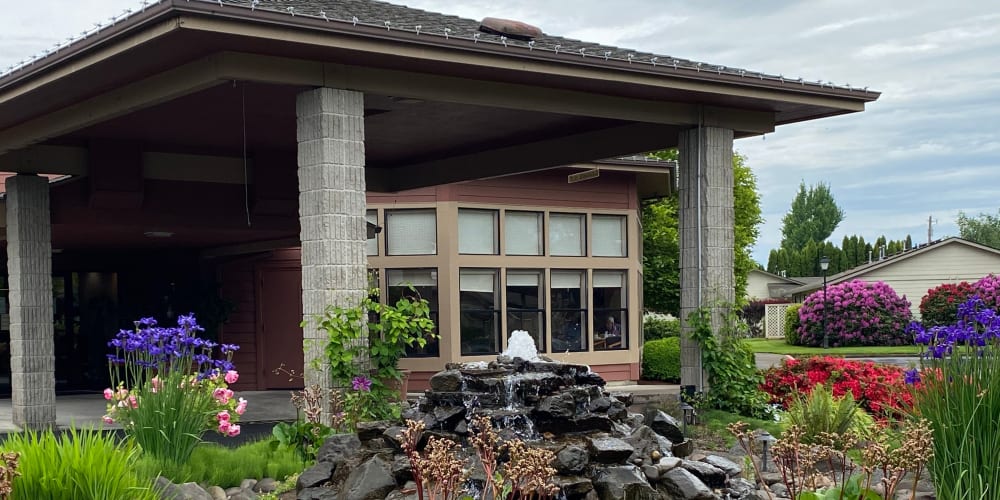 Lush landscaping and water feature at The Springs at Lancaster Village in Salem, Oregon