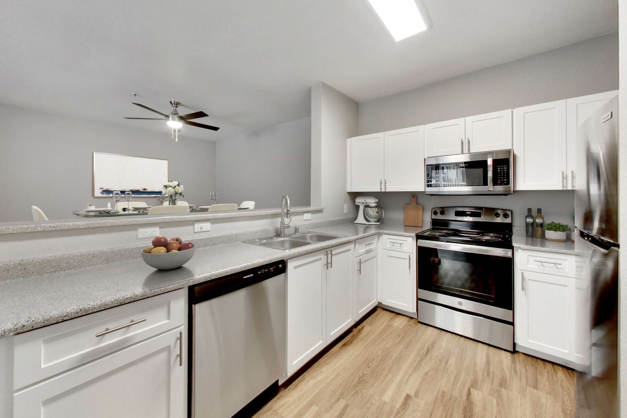 Kitchen room with stainless steel appliances at Natomas Park Apartments in Sacramento, California
