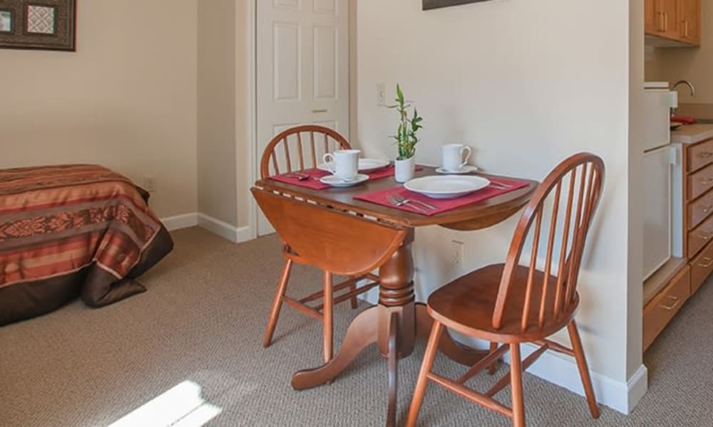 Resident apartment with small bistro table at Randall Residence of Troy in Troy, Ohio