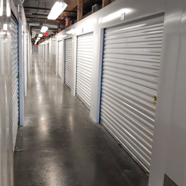 Drive-up access units with red doors at StorQuest Self Storage in North Miami, Florida