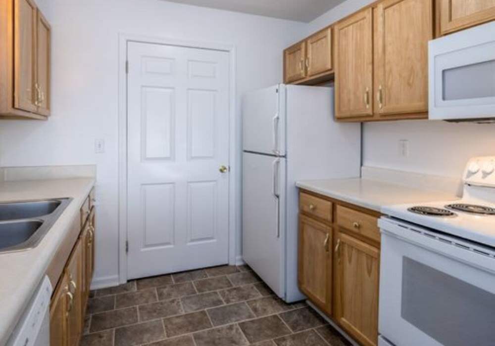 Kitchen of a modern apartment home at Heritage Park Apartments & Townhomes in Webster, New York