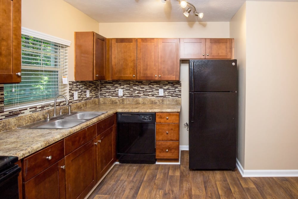 Fully-equipped kitchen at The Crossing at Henderson Mill Apartment Homes in Atlanta, Georgia